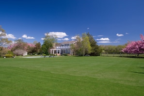 view of back of house and swimming pool