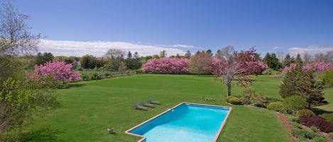 View of pool and backyard from upstairs balcony 