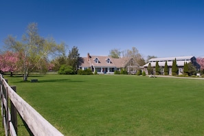 View of front of house and adjacent barn/gym
