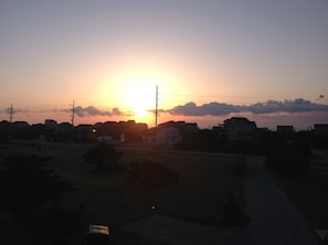 View of sunrise over the ocean from front deck.