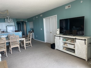 Living area with 65 inch Smart TV.