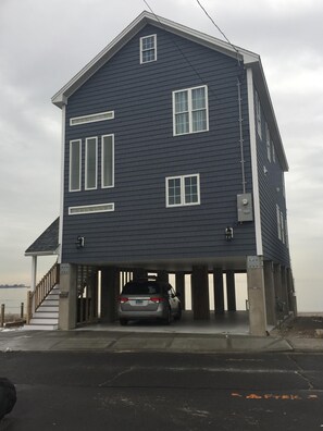 View from street. Park 4 cars right under the 2200 s.f. house. Covered stairs.