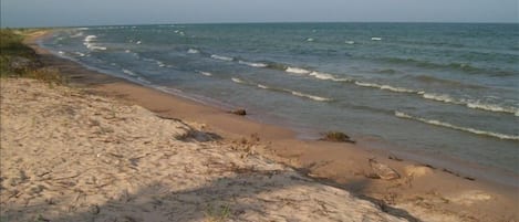 Clean sand beach with shallow water for children