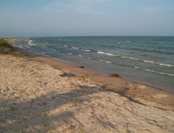 Clean sand beach with shallow water for children
