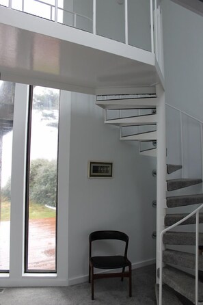 Stairs to upper level bedroom and bath