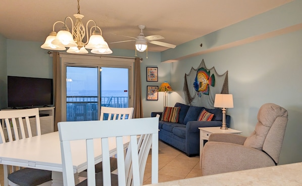The living room, dining area, and kitchen all have Gulf views.