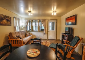 Living area with exit into screened covered porch