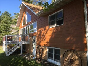 Front view of cabin overlooking lake
