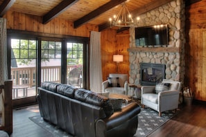 Main level living room, with walk out to deck and incredible panoramic lake view