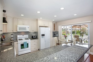 Unit A kitchen looks out to huge deck