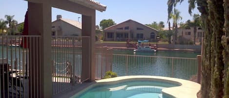 Pool with lake in background.