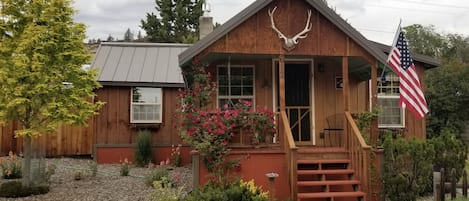 Inviting front porch swing to watch town activities or relax with a book