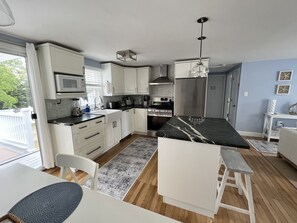 Stainless steel gas stove, refrigerator, dishwasher (with cabinet front)