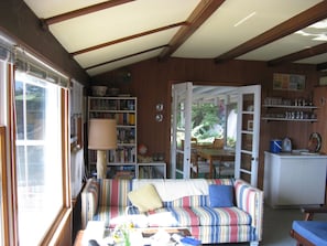 Living room; picture window. View into the porch.