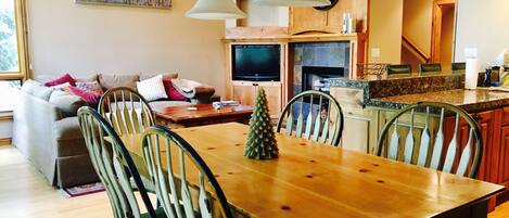 Our home! Open floor plan - kitchen, dining and living room with cozy fireplace