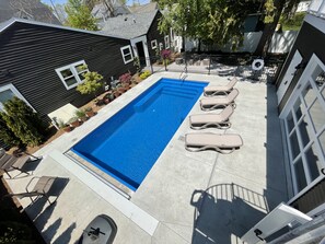 Pool from top of pool house - garage door opens to kitchen, ping pong, bathroom