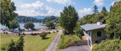 Aerial view overlooking cottage and lake