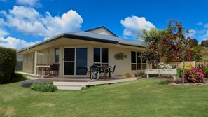 Searenity is surrounded by landscaped garden and lawned areas.