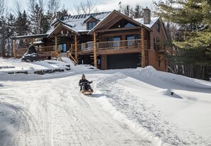 Sledding down the driveway.