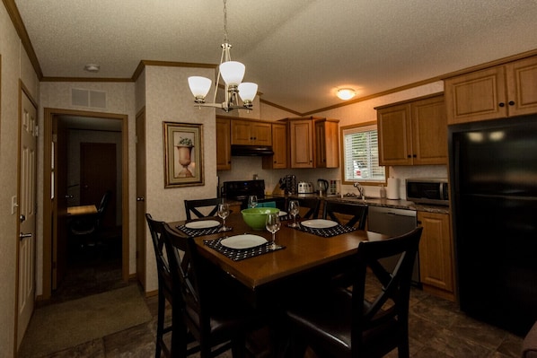 Open Living Space w/ Vaulted Ceiling.