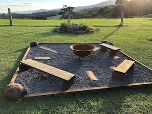 Enjoy a beverage around your own private firepit. Wood and kindling is supplied.