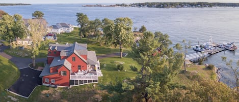 The Red cottage ---showing dock, boat house, main house, and view out the harbor