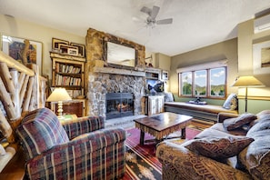 Our very cozy living room, with a wood burning fireplace and great views!