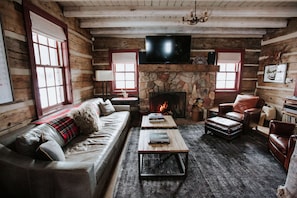 Living Room w Smart TV, fireplace, huge sofa