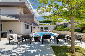 Private pool and garden with covered outdoor furniture for 14 people