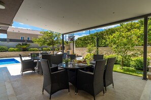 Private pool and garden with covered outdoor furniture for 14 people