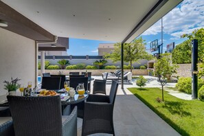 Private pool and garden with covered outdoor furniture for 14 people