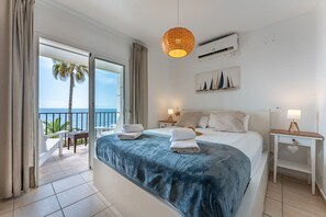 main bedroom with beach views and a private terrace