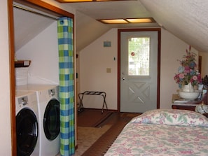 Entry has a twin bed and HE washer/dryer andsmall freezer.