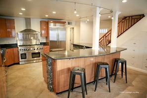 Spacious gourmet kitchen with bar seating for five
