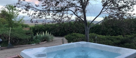 The Hot tub on the front porch has beautiful views of the surrounding areas.