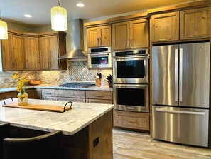 Double oven and 6 burner gas stove top.
Fully stocked kitchen.