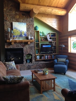 20' ceilings and a wall of glass welcome nature into the comfortable great room.