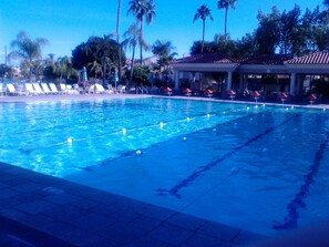 Heated junior Olympic size pool with covered gazebo and seating area.