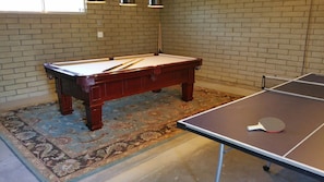 Pool table and ping pong for guests to enjoy.