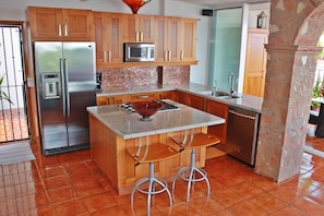 Kitchen w/all the utensils, pots, and pans you would ever need.