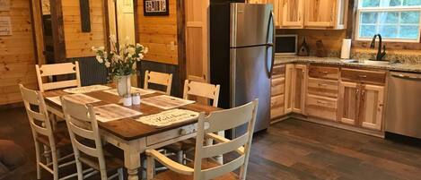 Dining room table and Stainless steel appliances