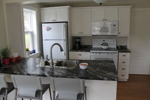 The kitchen is fully loaded with a dishwasher and everything you need for meals.