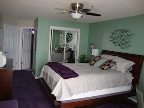 primary bedroom, walk-in closet with built-in wooden cabinets