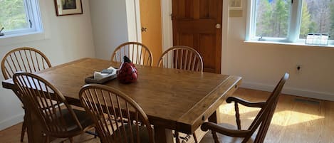 Dining area within the great room. Leaves to expand the table are in the closet.