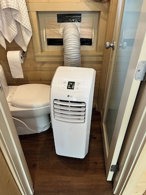 AC Unit - keeps tiny house nice and cool on those sweltering hot days.