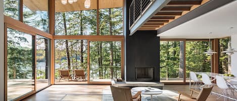 The house features expansive views over the lake and mountains to the north