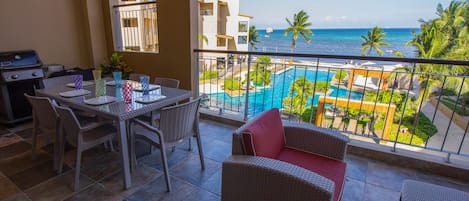 Private balcony with BBQ, table for eating and comfortable lounging area