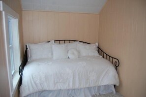 Twin size bedroom with pop up twin size trundle bed