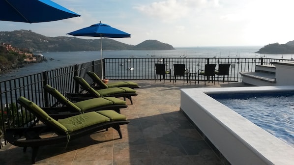 Large terrace and dipping pool with view of the bay