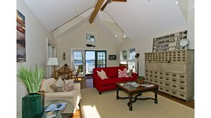 Comfortable and thoughtfully decorated great room with vaulted ceiling.